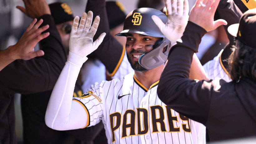 San Diego Padres shortstop Xander Bogaerts high-fiving teammates