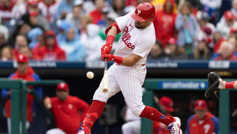 Kyle Schwarber swings; Philadelphia Phillies