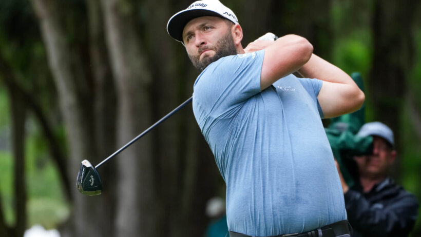 Jon Rahm hitting a tee shot