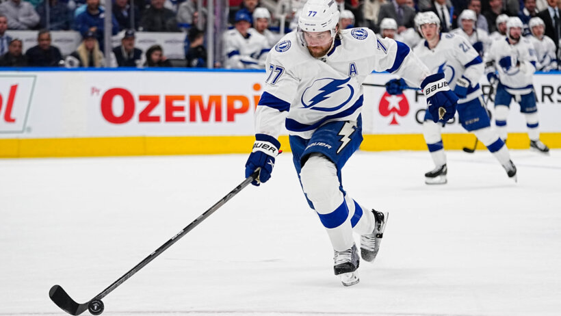 Tampa Bay Lightning defenseman Victor Hedman tries to control the puck against the Toronto Maple Leafs