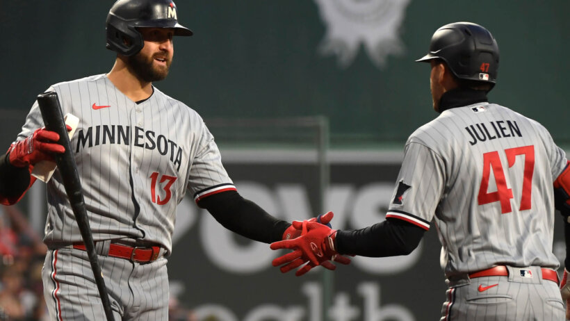 Minnesota Twins second baseman Edouard Julien celebrates with first baseman Joey Gallo