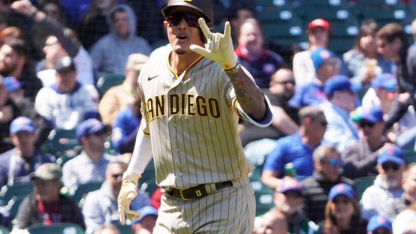 Manny Machado celebrates a home run versus the Cubs