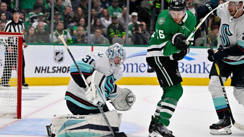 Dallas Stars center Joe Pavelski attempts to redirect the puck past Seattle Kraken goaltender Philipp Grubauer