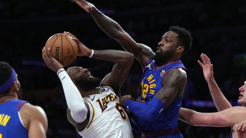 LeBron James is swarmed by the Nuggets defense
