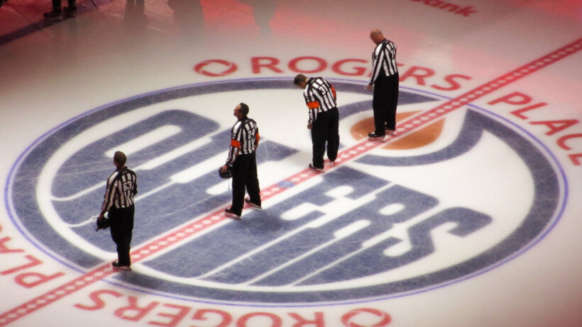 The anthem is played at Rogers Place during a game between the Oilers and Flames