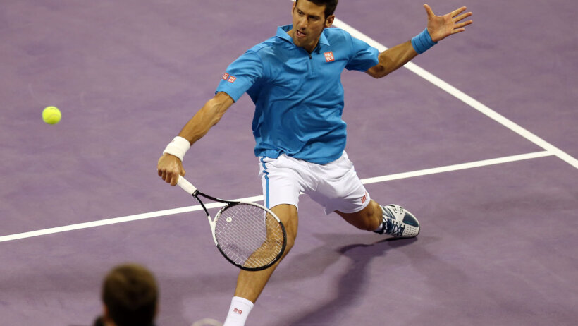 Djokovic returning a ball in Qatar.