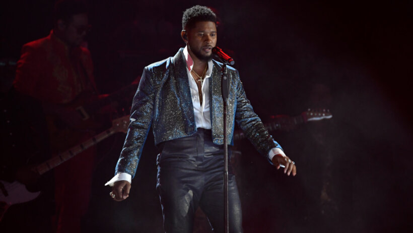 Usher performs on stage