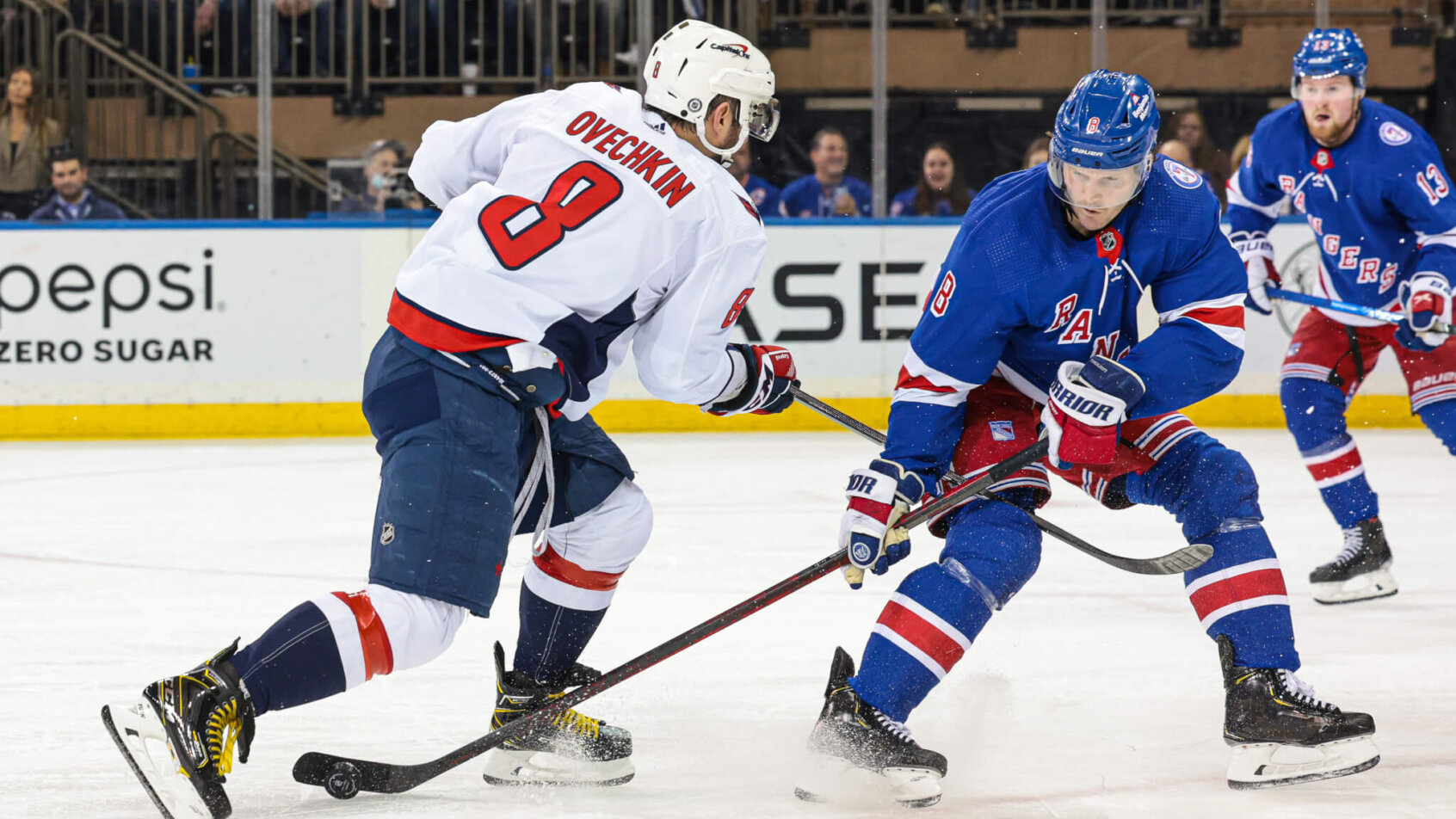 New York Rangers defenseman Jacob Trouba tips the puck away from Washington Capitals left wing Alex Ovechkin during the second period at Madison Square Garden