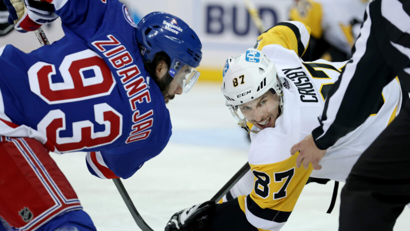 Pittsburgh Penguins center Sidney Crosby takes a face off against New York Rangers center Mika Zibanejad
