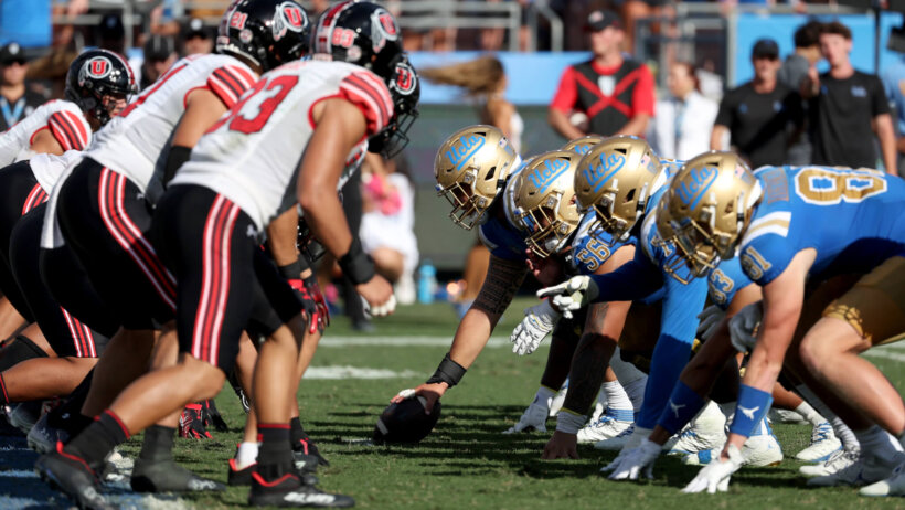 The UCLA Bruins offensive line on the line of scrimmage against the Utah Utes