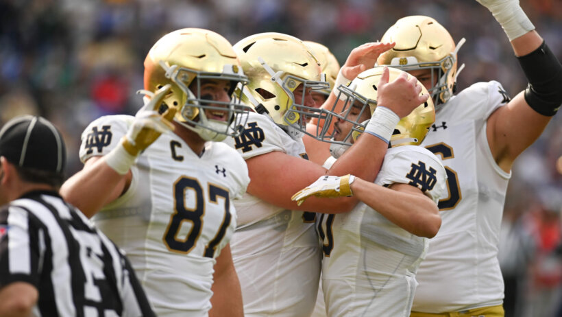 Notre Dame Fighting Irish players celebrating a TD against the Navy Midshipmen