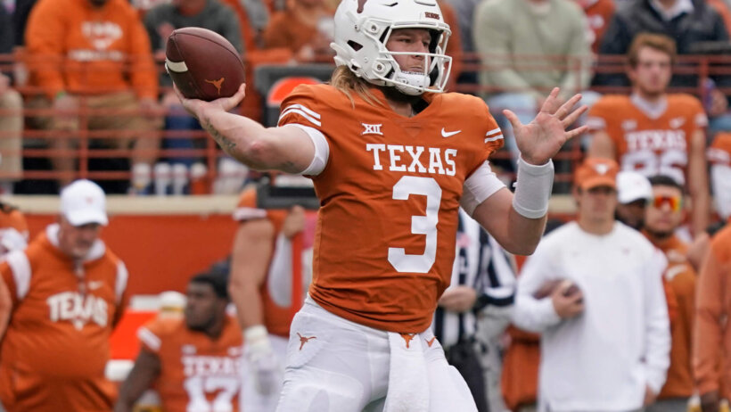 Texas Longhorns quarterback Quinn Ewers throws the football