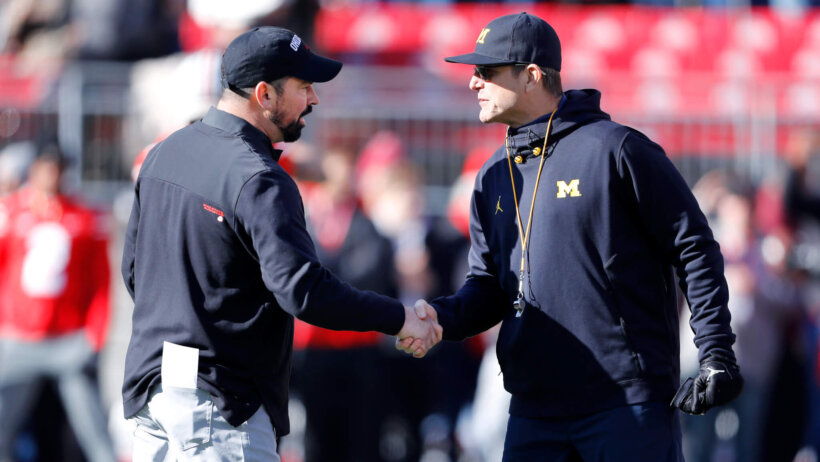 Michigan Wolverines head coach Jim Harbaugh and Ohio State Buckeyes head coach Ryan Day shake hands