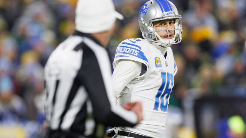 Detroit Lions quarterback Jared Goff talks to an official