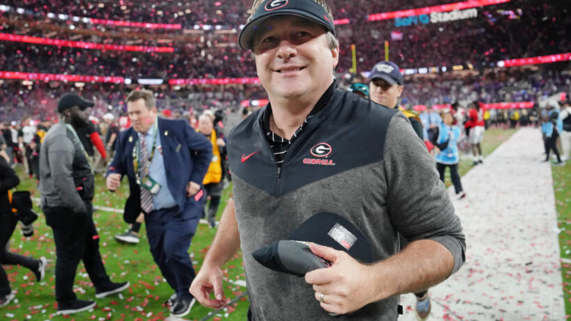 Georgia Bulldogs head coach Kirby Smart runs off the field after winning National Championship