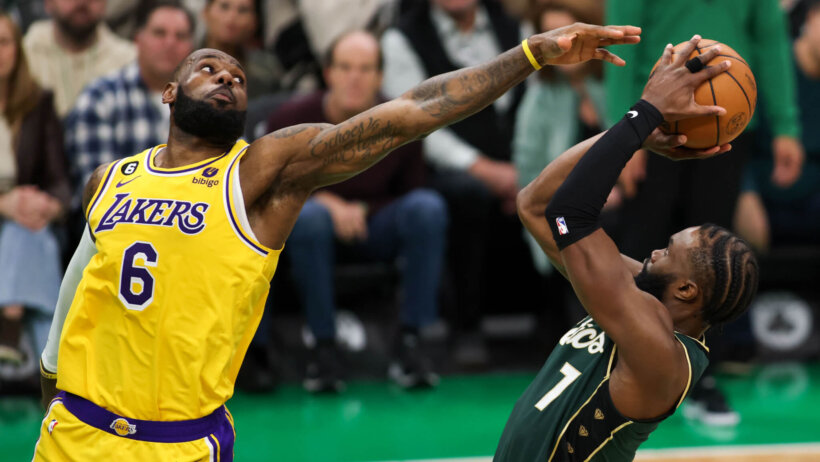 Boston Celtics forward Jaylen Brown shoots a fadeaway against Los Angeles Lakers forward LeBron James