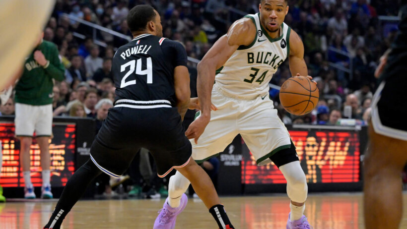 Milwaukee Bucks forward Giannis Antetokounmpo dribbles while Los Angeles Clippers forward Norman Powell defends