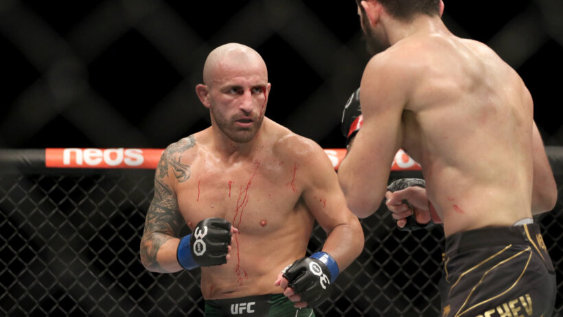 Islam Makhachev fighting Alexander Volkanovski