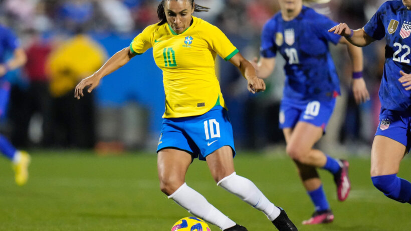 Brazil forward Marta (10) dribbles the ball against United States of America