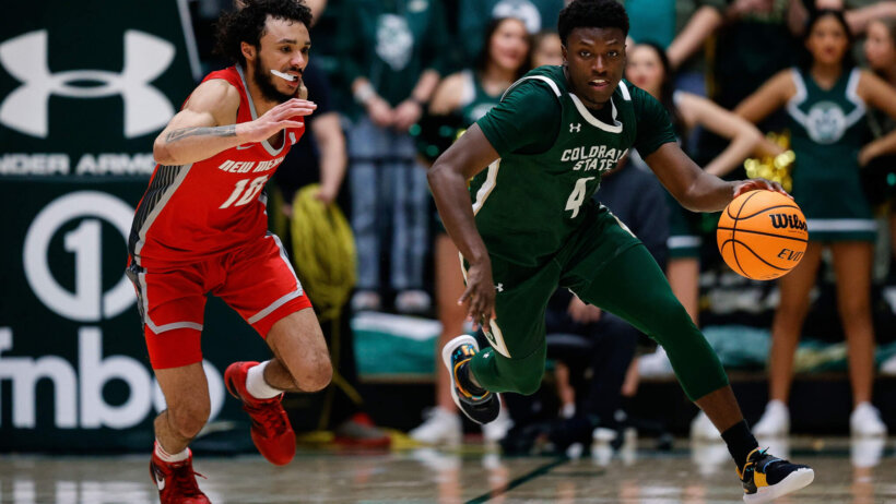 Colorado State Rams guard Isaiah Stevens dribbling against New Mexico Lobos guard Jaelen House
