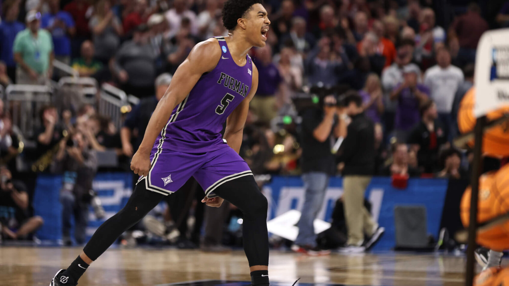 Furman Paladins guard Marcus Foster celebrates a win