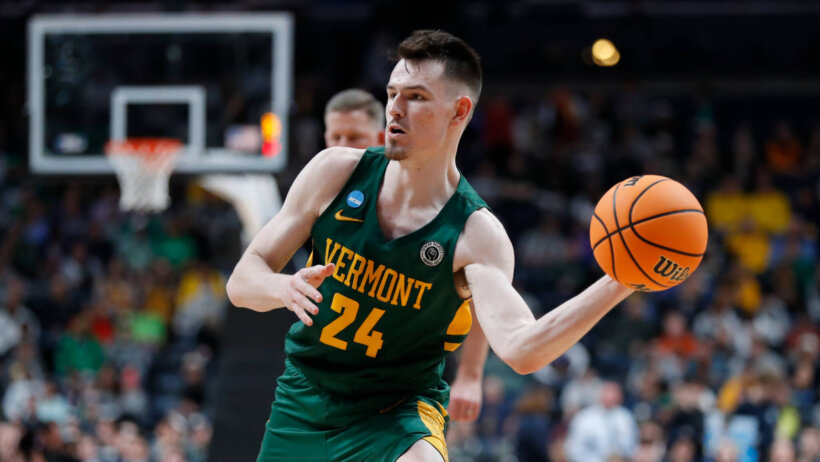 Vermont Catamounts basketball player ball in hand