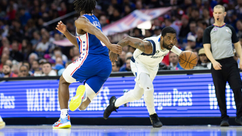 Dallas Mavericks guard Kyrie Irving drives past Philadelphia 76ers guard Tyrese Maxey