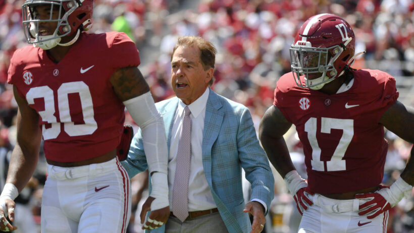 Nick Saban talking to players