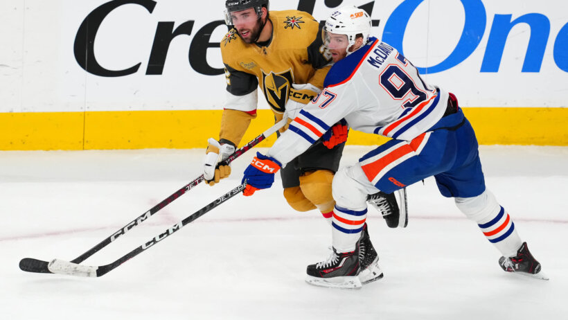 Edmonton Oilers center Connor McDavid battles for position against Vegas Golden Knights right wing Michael Amadio