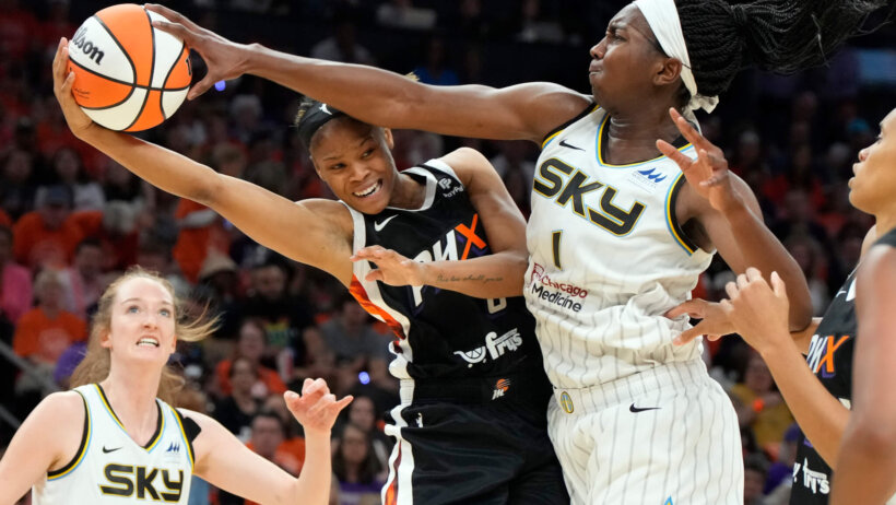 Chicago Sky guard Elizabeth Williams rejecting Phoenix's Moriah Jefferson