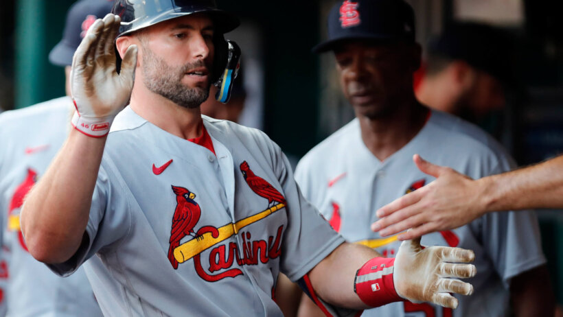 Paul Goldschmidt celebrates in the dugout