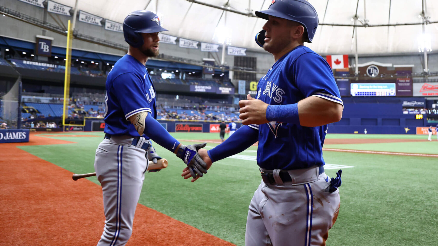 Toronto Blue Jays Nathan Lukes congratulating Daulton Varsho.