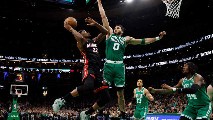 Miami Heat forward Jimmy Butler goes for a layup against Boston Celtics forward Jayson Tatum