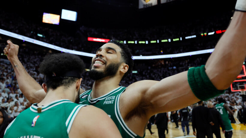 Jayson Tatum celebrates with Derrick White