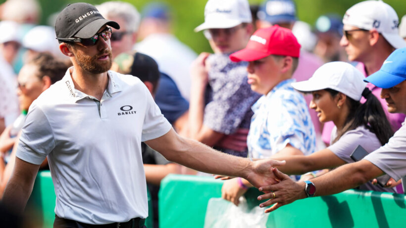 Patrick Rodgers slaps hands with fans at the Memorial Tournament.
