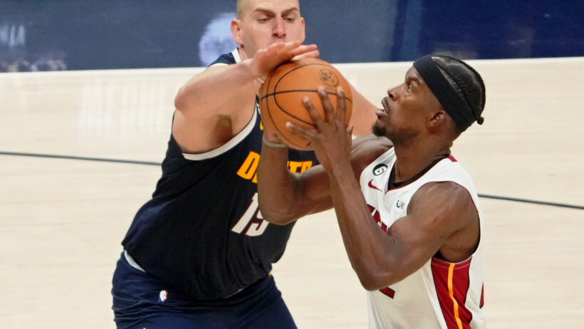Nikola Jokic halts a Jimmy Butler drive