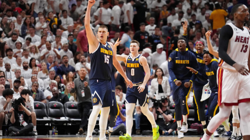 Nikola Jokic arm up celebrating