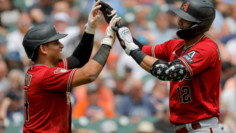 Lourdes Gurriel Jr congratulated by Gabriel Moreno