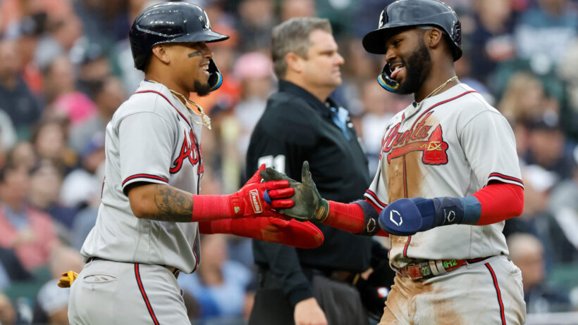 Orlando Arcia and Michael Harris II celebrate