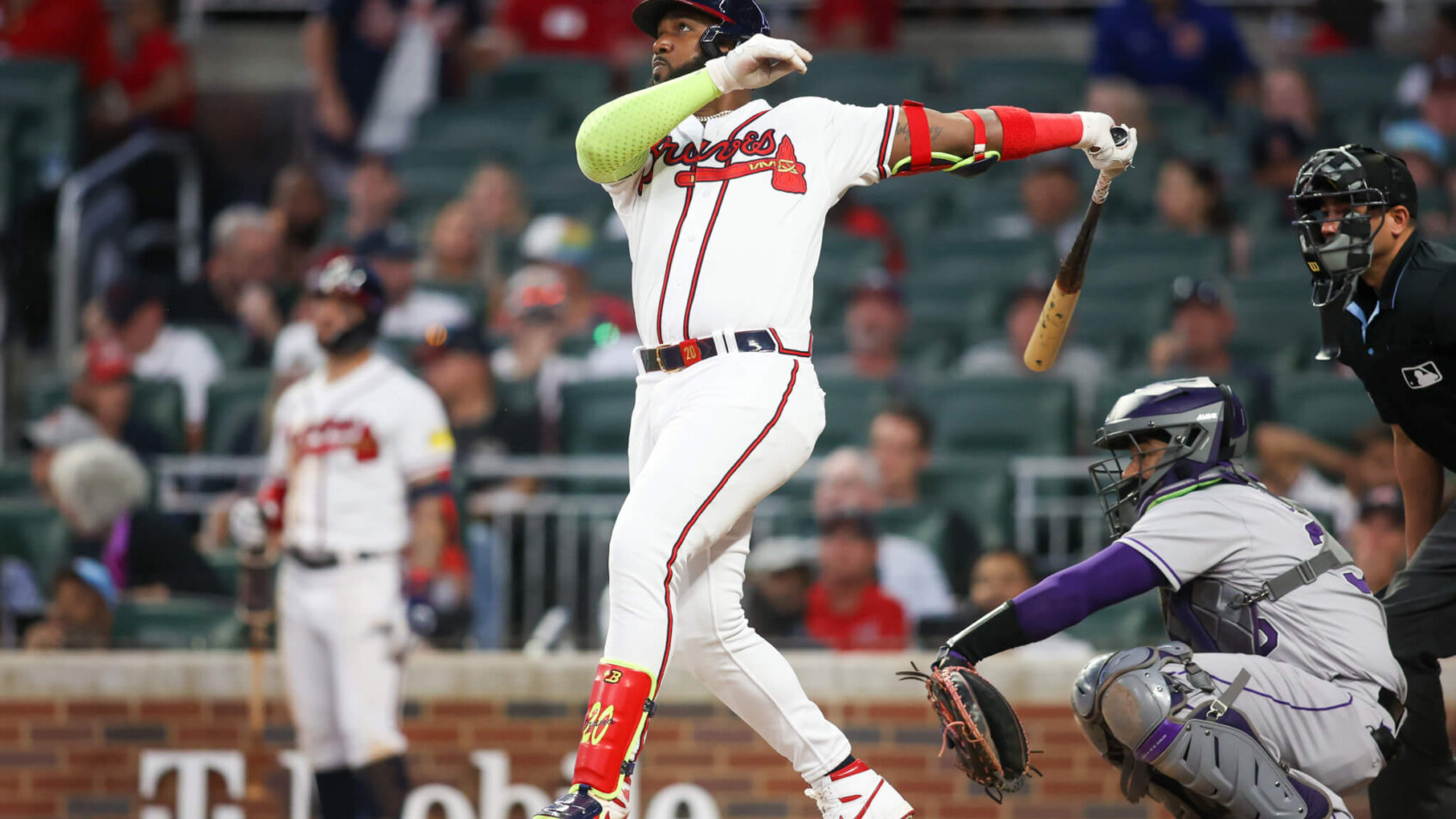 Marcell Ozuna drives in a run versus the Rockies.