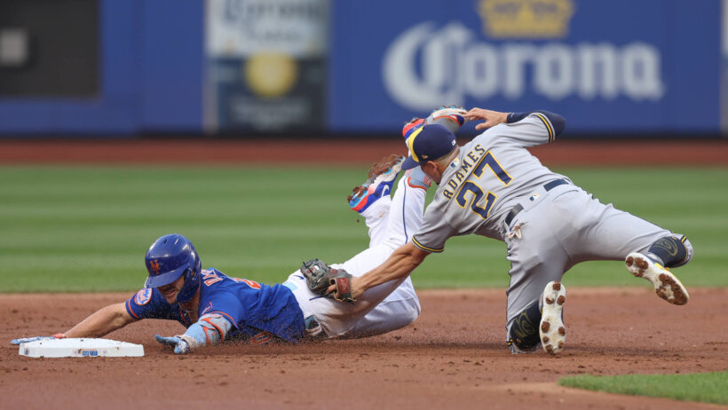 New York Mets first baseman Pete Alonso tagged out at second base by Milwaukee Brewers shortstop Willy Adames