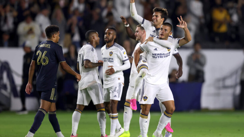 Los Angeles Galaxy midfielder Riqui Puig (6) celebrates with forward Dejan Joveljic
