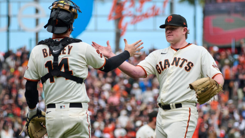 Logan Webb celebrates his complete-game shutout.