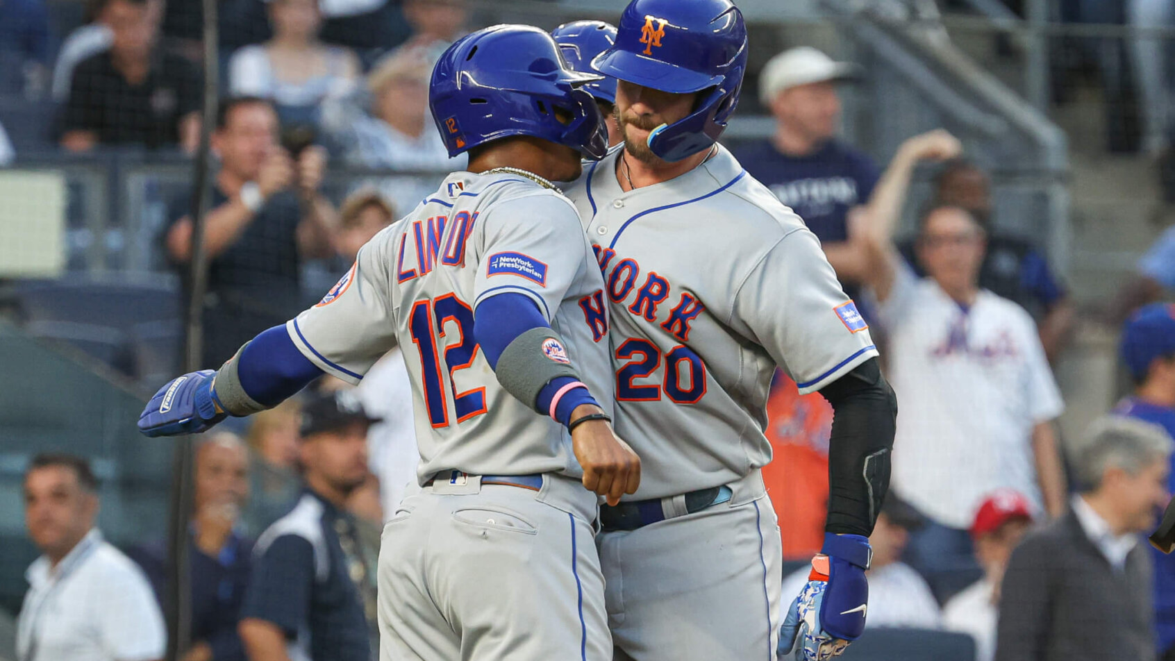 Pete Alonso celebrates a home run with Francisco Lindor.