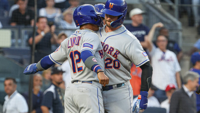 Pete Alonso celebrates a home run with Francisco Lindor.