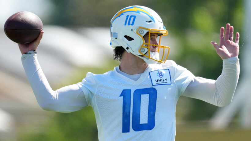 Los Angeles Chargers quarterback Justin Herbert throws the ball during training camp