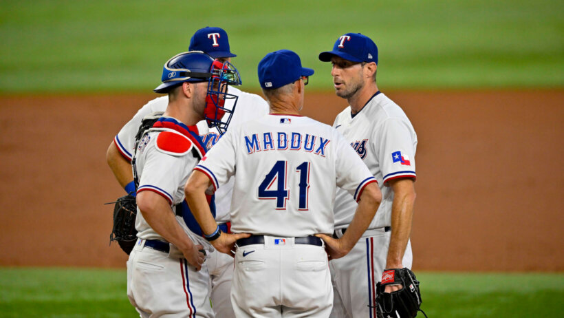 Texas Rangers pitching coach Mike Maddux talks to Max Scherzer