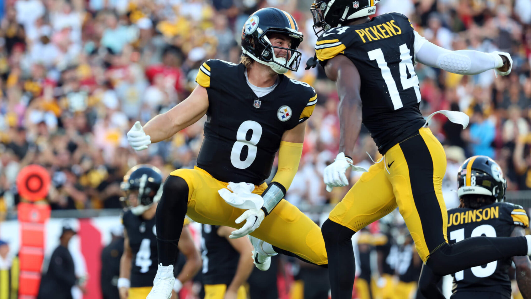 Pittsburgh Steelers wide receiver George Pickens (14) celebrates with quarterback Kenny Pickett (8)