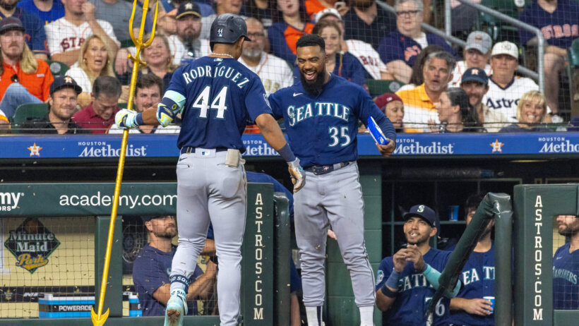 Seattle Mariners right fielder Teoscar Hernandez celebrates with center fielder Julio Rodriguez