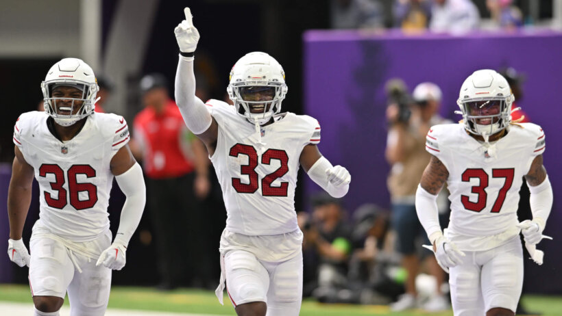 Arizona Cardinals safety Sean Chandler (32) reacts to an interception with safety JuJu Hughes (36) and cornerback Quavian White (37)